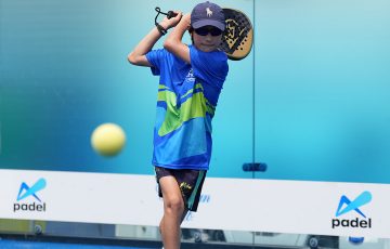 A young fan plays padel.