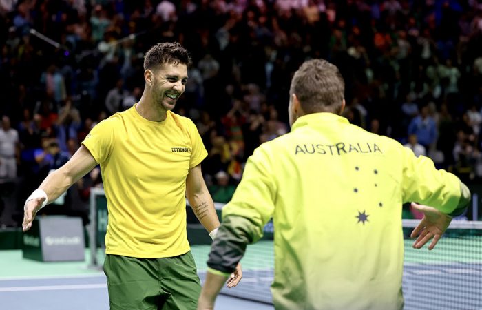 Thanasi Kiokkinakis celebrates with Australian Davis Cup Captain Lleyton Hewitt; Getty Images 