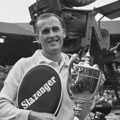 Neale Fraser with the men's singles trophy after beating fellow Australian Rod Laver in the final at the 1960 Wimbledon Championships [Credit: Evening Standard/Hulton Archive/Getty Images]