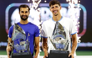 DUBAI, UNITED ARAB EMIRATES - MARCH 01: Yuki Bhambri of India and Alexei Popyrin of Australia celebrate with their trophies after victory over Harri Heliovaara of Finland and Henry Patten of Great Britain in the doubles final during day fourteen of the Dubai Duty Free Tennis Championships at Dubai Duty Free Tennis Stadium on March 01, 2025 in Dubai, United Arab Emirates. (Photo by Christopher Pike/Getty Images)